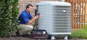 An expert technician repairing an air conditioner unit outside