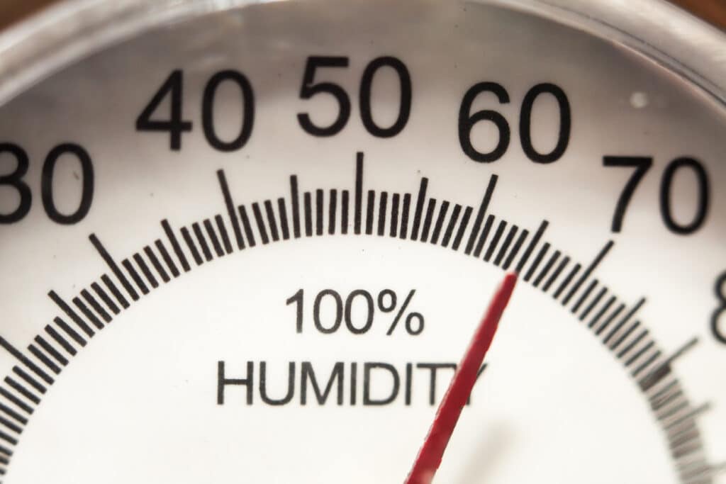 Hygrometer gauge showing humidity levels at 65%